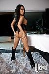 Busty Asian in high heeled leather boots Asa Akira shakes the melons and shows nub nudity