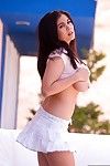 Voluptuous Asian Mai Ly unties top and bares sexy big breasts outdoors