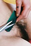 Asian amateur Junko folds back labia lips of hairy cunt after skirt removal