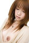 Asian porn model Reika Shiina tempts with a see through dress and her little tits in a solo session