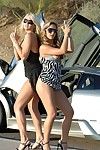Lez girls Alison Angel and Lia 19 show their milk cans and wet cracks outdoors beside expensive car