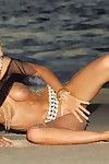 Slender fairy-haired hottie Natasha Marley shows her naughty parts in soggy sand on the beach