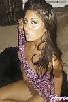 Hot dark haired chica Raven Riley exposes her shaved pussy and slides fingers in her hole