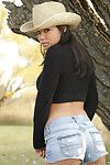 Hot brunette cowgirl posing sexy in superb outdoor solo action