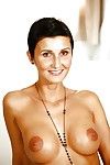 Topless short-haired MILF with round tits revealing her shaved honey pot