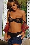 Sexy porn diva Crissy Moran pulls down her black lace lingerie and toys her lovely pussy