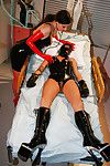 Kinky BDSM lezdom sex with busty latex attired lesbians in boots and mask