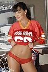 Baring her cheerleader shirt and red lingerie big boobed Lisa Ann dildos her slit