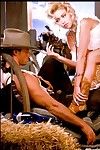 Busty blonde babe Jenna Jameson teases a muscular cowboy yearning for hot games
