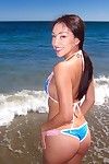 Amateur asian sweetie Vicki Chase posing on the beach in a bikini