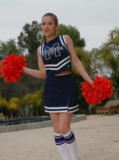 Adolescent cheerleader Dani Daniels pulls up her skirt to toy her gloryhole