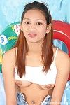 Pretty Thai teenager in glasses undresses stripped to amplify shaggy gentile