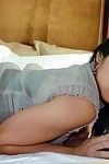 Pervy darkish haired Chinese angel Mika Tan reveals her damp body on the ottoman