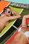 Good-looking and hot brunette teen adjacent to sunglasses is masturbating the brush dolls twat outdoors